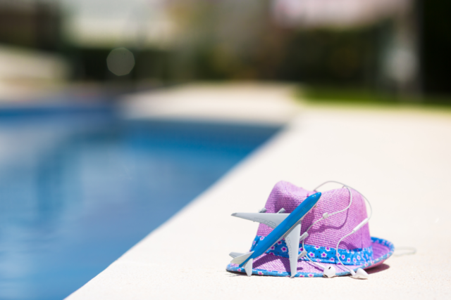 An image of an aircraft and purple straw hat representing a worker utilizing unlimited PTO.