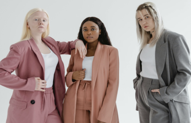 An image of three professional women to represent embracing microfeminism at work.