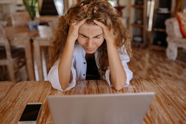 An image of a stressed woman representing workplace stress.