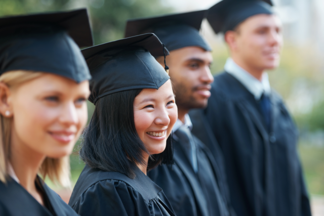 An image of graduates representing employees who have leveled up their skills while being supported with tuition reimbursement.