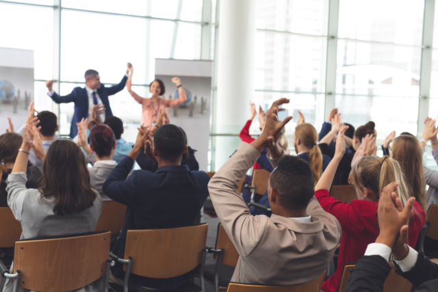 An image of a professional event representing HR leaders unlocking HR strategies at a conference.