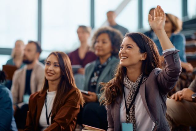 Am image of professionals at a conference, representing HR teams learning to lead their employees through the future of HR at the HRPA Conference.